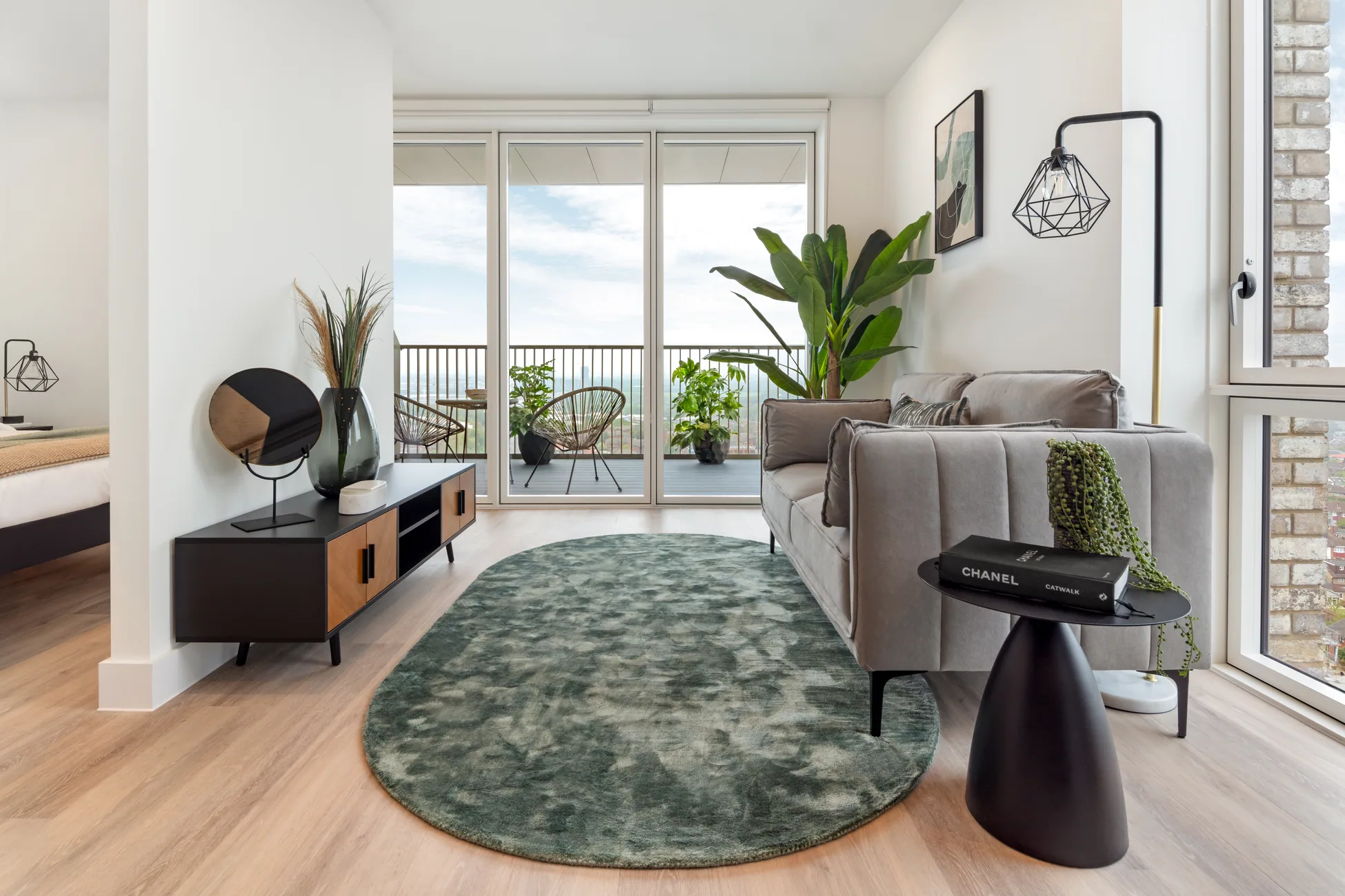 The Verdean Studio sofa and living area opening towards the balcony