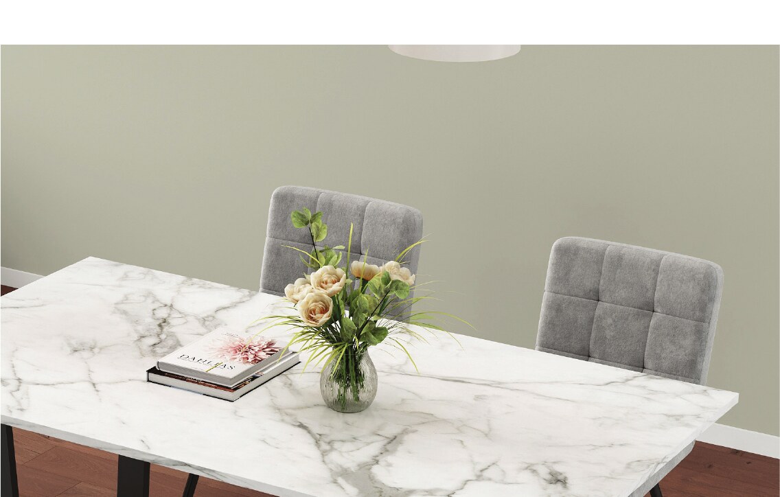 Close-up of a marble dining table and flowers